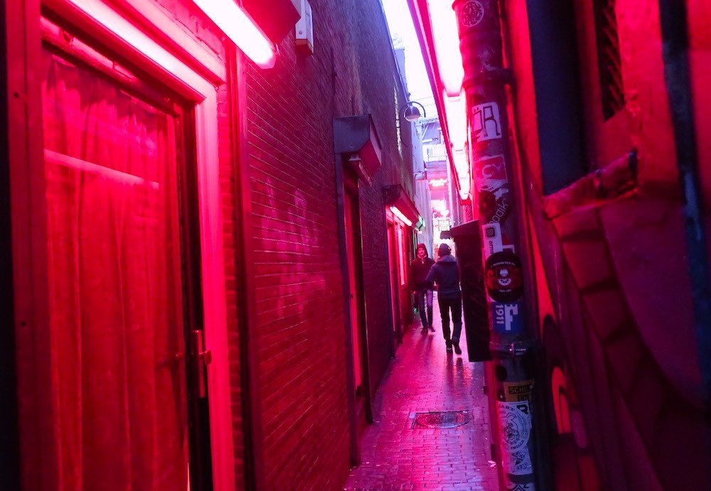 Trompettersteeg: a red-lit narrow alley in Amsterdam