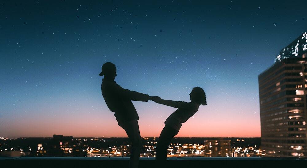 couple in love on a rooftop in a Dutch city