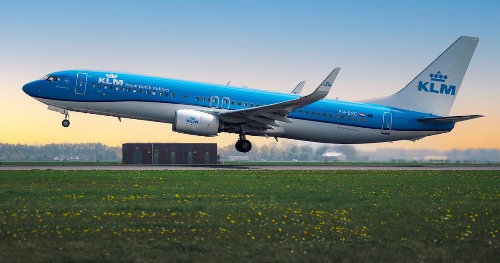 blue KLM airplane on Amsterdam airport arriving in the Netherlands